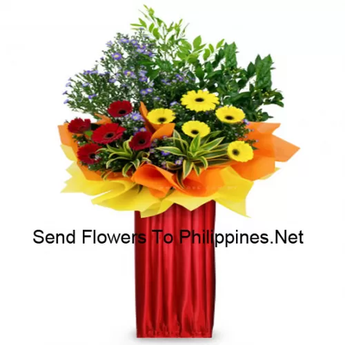 A Tall Congratulatory Stand Made Of Red Gerberas, Yellow Gerberas And Other Ferns And Fillers