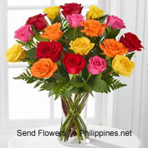 18 Mixed Colored Roses With Seasonal Fillers In A Glass Vase