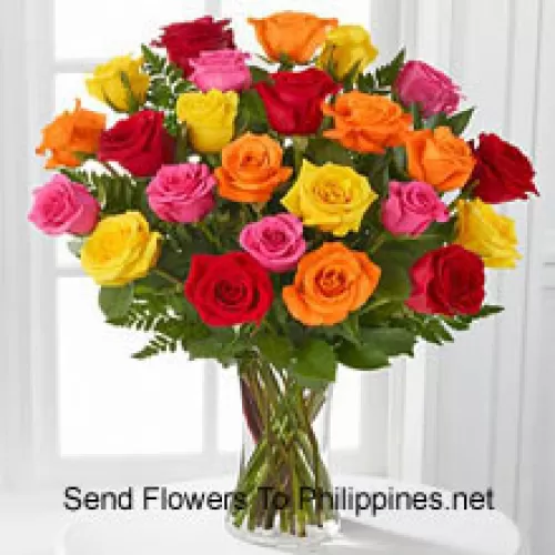 24 Mixed Colored Roses With Seasonal Fillers In A Glass Vase